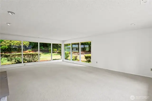 Another angle of Family room.Tons of natural light pour in from the windows.