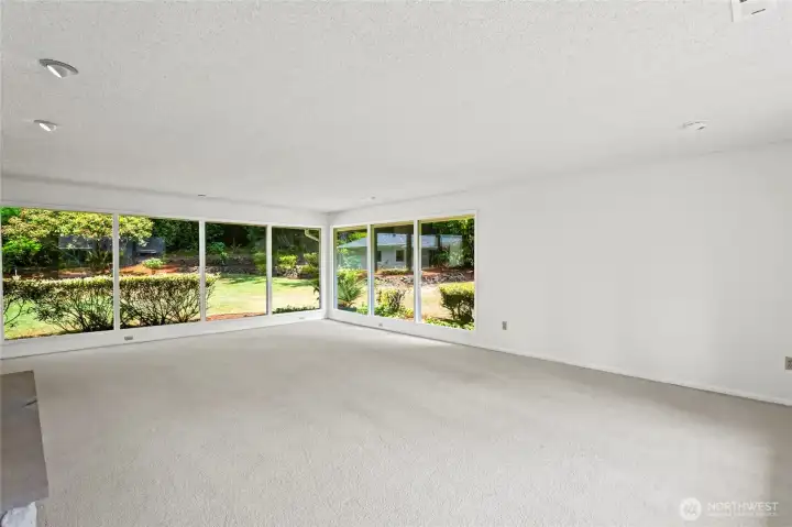 Another angle of Family room.Tons of natural light pour in from the windows.