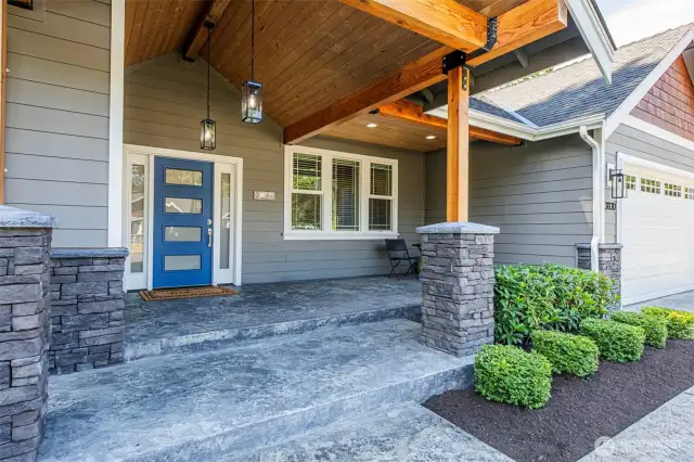 Exceptional grand entry with covered porch sitting area