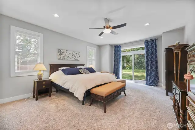 Generous sized Owner suite with large sliders to outside patio