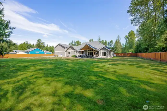 Flat one acre and private back yard setting