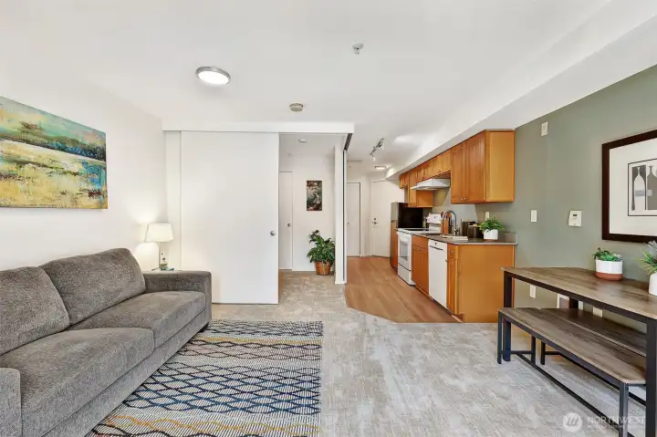 This is a very very useable 365 square feet of home. It can have a study, it can have a queen sized bed, it can host guests for a meal, and the kitchen has counter space with the full sized stove/oven and dishwasher. The fridge is smaller, but fits the entry space very well. The over-fridge cabinets clearly allow for a larger unit, if desired.