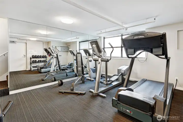 The "Exercise Room" is off the lobby. It's a versatile and convenient gym space for residents.