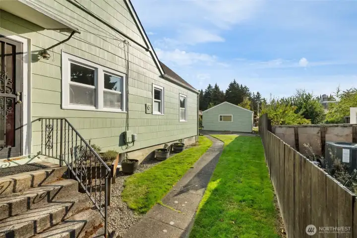Fenced Back Yard leads to 2 Car Garage