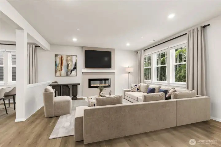 So much light throughout the great room, dining room and kitchen.  Photos are for representational purposes only. Colors and finishes may vary