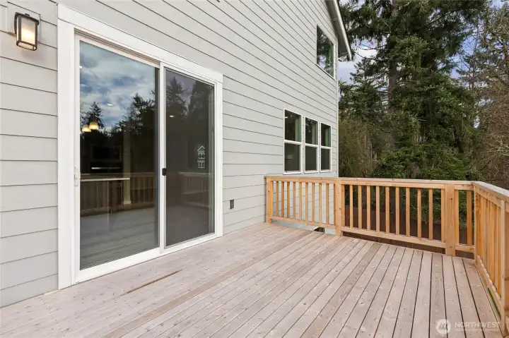 Deck from main floor. Photos are for representational purposes only. Colors and finishes may differ.