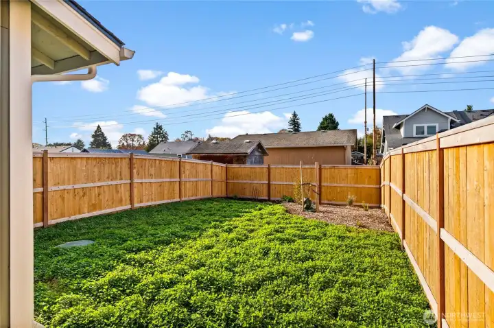 Step outside from the living room into the fully fenced backyard and enjoy the sun!