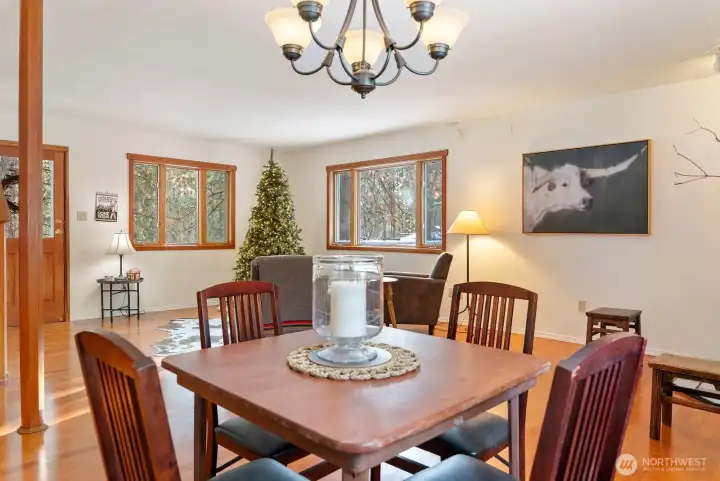 Cozy up and gather here all seasons comfortably. Hardwood floors. Large wood trimmed windows allow natural light and views.