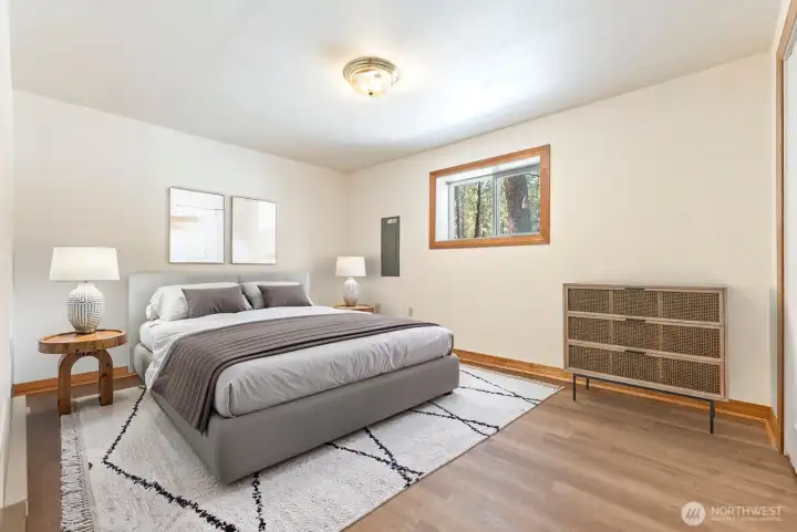 Walk-out Daylight Basement level Bedroom No. 3 enjoys Vinyl plank floor, Large Closet, natural light from westerly facing window. Clean lines and fresh space. Refresh and relax everyday.