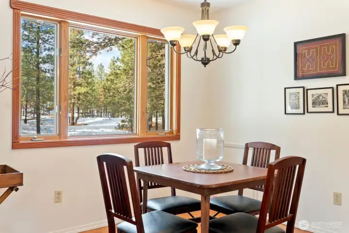 Large picture window brings natural light to your meals here!