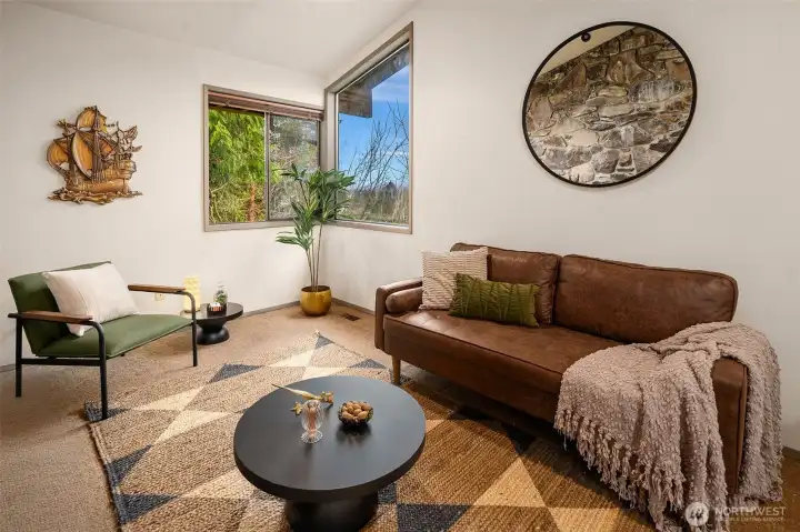 Connected to the living room and featuring a private entry, this room offers exceptional flexibility of use.