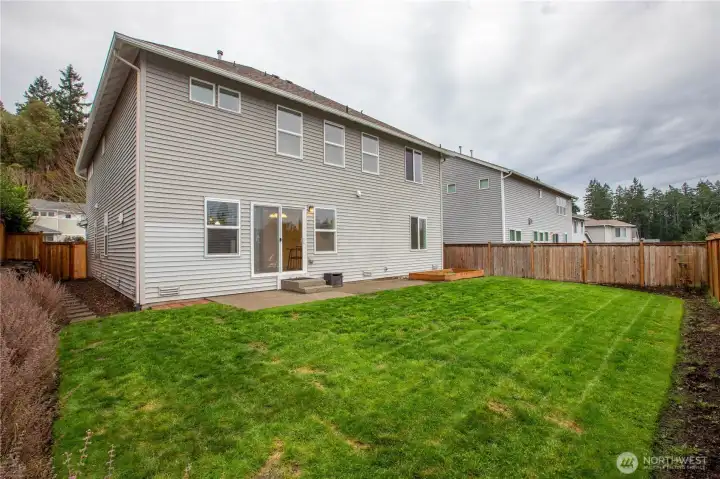 fully fenced backyard with side gate