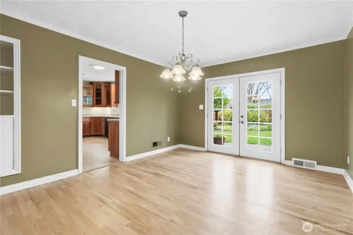 Dining room with French doors leading to backyard and patio