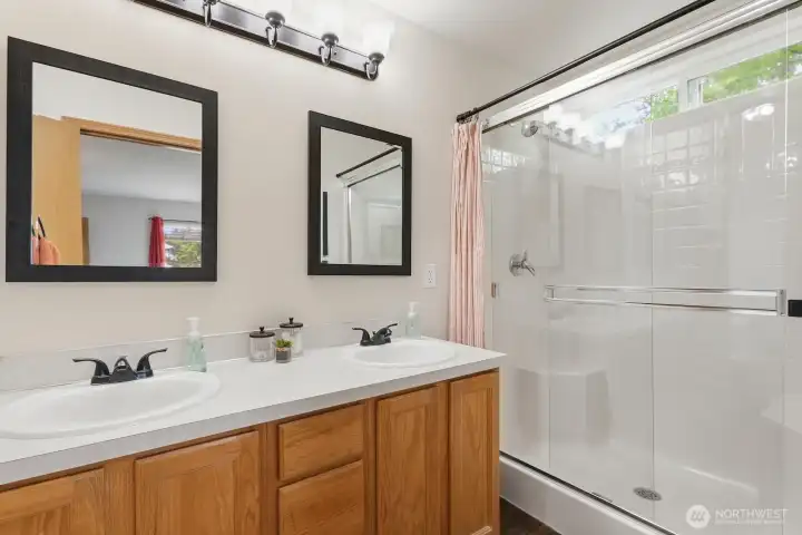 Primary Bathroom features Dual Vanities and Private W/C
