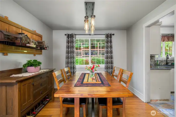 The adjacent dining room that overlooks the manicured backyard.