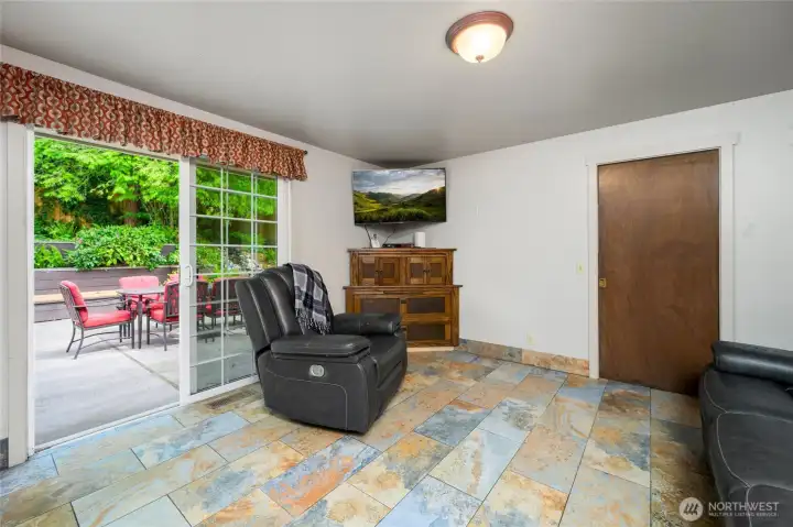 Television/den/entertainment space that flows effortlessly to the patio.