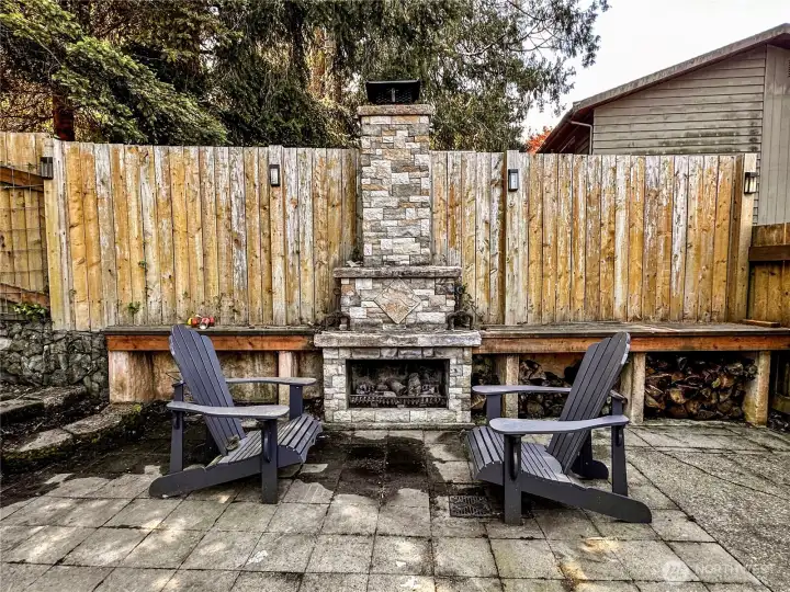 Stone wood burning fireplace for epic gatherings, relaxing evenings, or for making smores.
