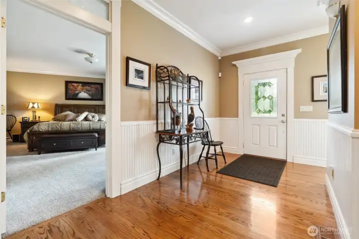 Main level entry with Primary bedroom to left. Main level entry with Primary bedroom to left.