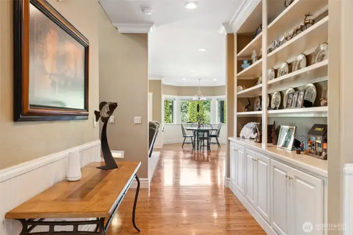 Entry hall with built-in display through to family room kitchen area. Entry hall with built-in display through to family room kitchen area.