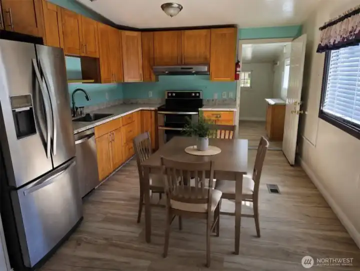 Virtually staged kitchen w/eating space