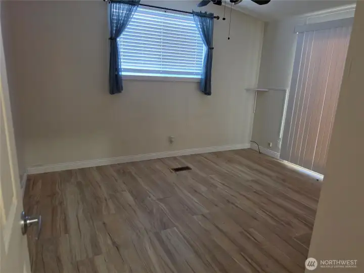 Primary bedroom w/ door to back deck