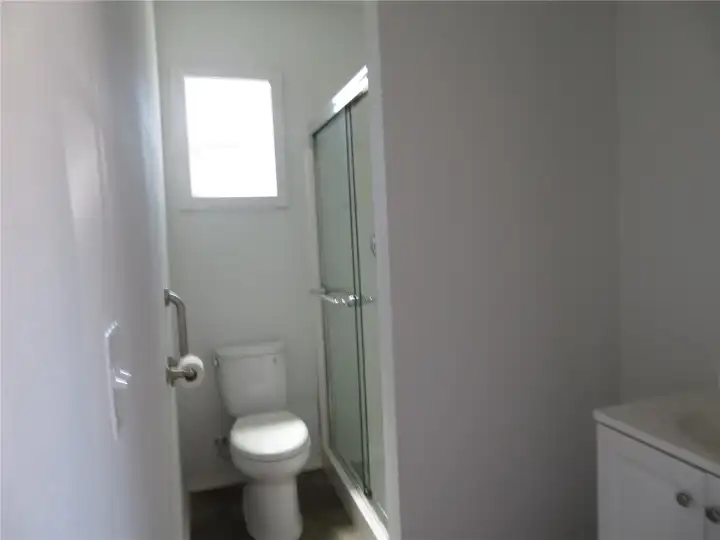 Apartment bathroom with walkin shower