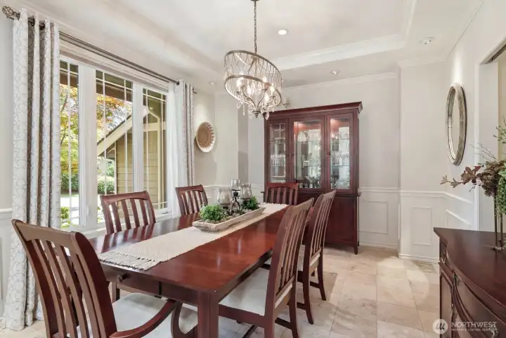 Across from the living room, the formal dining room offers an elegant setting for entertaining and special occasions.