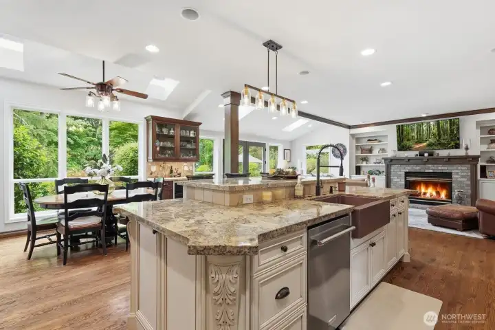Hardwood floors extend throughout the space, while multiple skylights bathe the rooms in natural light.