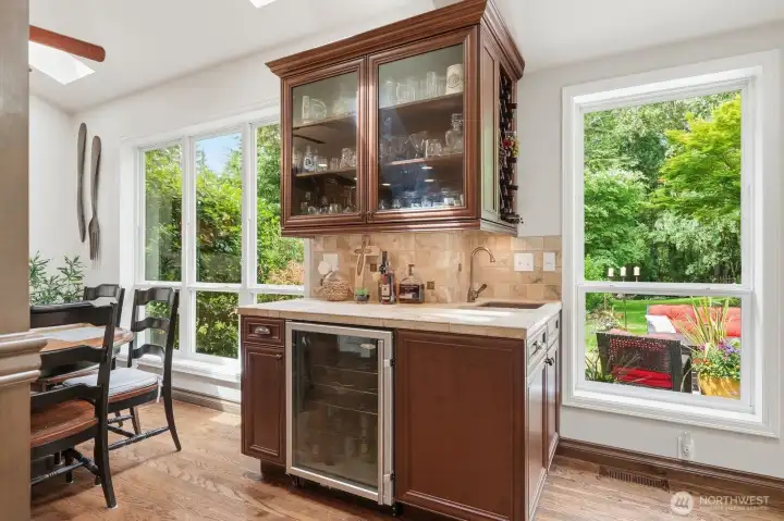 The wine bar with sink and beverage fridge off the informal dining area.