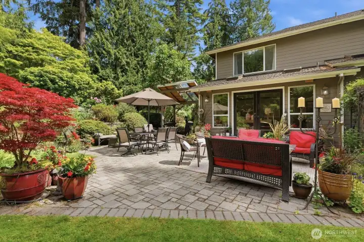 One of the home’s most captivating features is its connection to the extraordinary outdoor gardens. French doors open from the family room to an expansive stone patio looking onto the terraced wall filled with blueberries, a variety of flowering shrubs, roses, perennials and annuals while a soothing 3 level waterfall creates a peaceful retreat-like atmosphere.