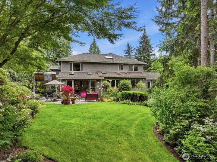 The garden feeds both the senses and the palate. A vegetable garden gets the sunniest location while shade lovers enjoy the margins of the woods. The grounds showcase an impressive collection of mature trees and specimen plantings, including Japanese maples, evergreen varieties, flowering dogwoods, cherry blossoms, flowering golden chain trees, lilacs, roses and fruit trees.