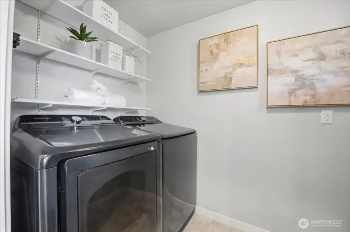 Laundry room next to kitchen