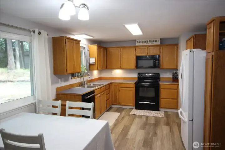 Kitchen off of living room with dining room Kitchen off of living room with dining room