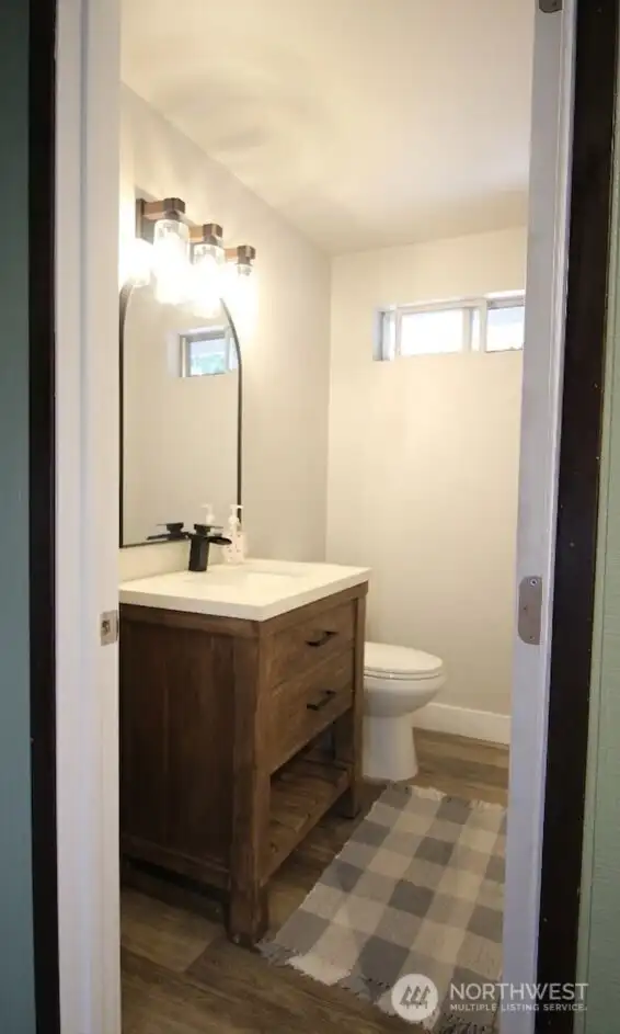 Half Bath adjacent to Rec room and garage access. Half Bath adjacent to Rec room and garage access.