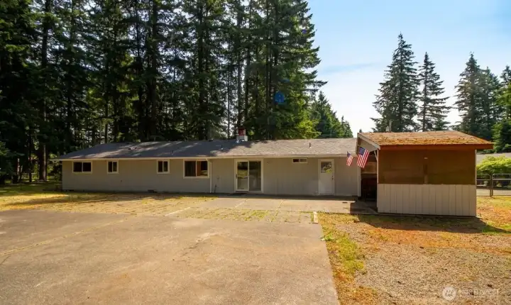 Backyard shed is currently used for covered outdoor cooking. Backyard shed is currently used for covered outdoor cooking.