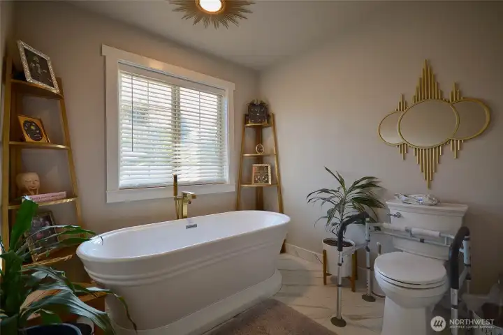 Beautiful heated porcelian tiled floors are throughout the main bath area. The gorgeous stand alone slipper tub is the answer to a stressful day. Relax and enjoy. Beautiful heated porcelian tiled floors are throughout the main bath area. The gorgeous stand alone slipper tub is the answer to a stressful day. Relax and enjoy.