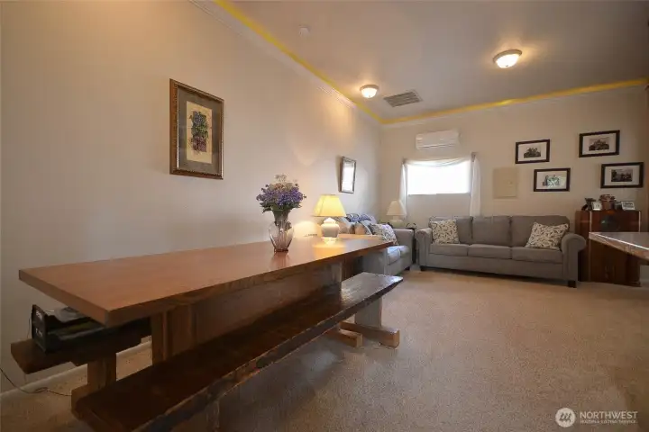 Dining room and living rooms of the ADU. Note the finishing with crown molding, wainscotting and carpeted floors. Dining room and living rooms of the ADU. Note the finishing with crown molding, wainscotting and carpeted floors.
