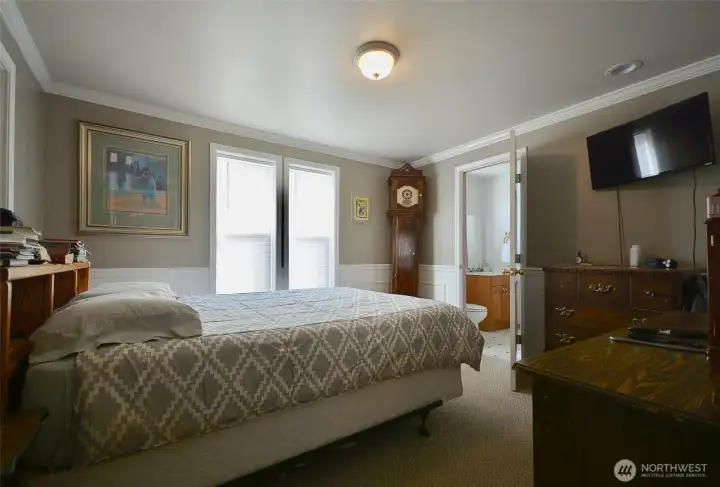 The main bedroom is on the lower level and has a convenient access door to the in ground pool area. The main bedroom is on the lower level and has a convenient access door to the in ground pool area.