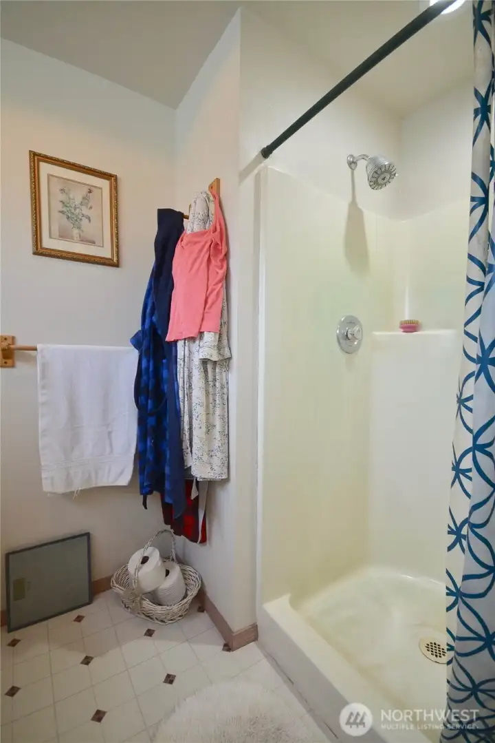 The bathroom is equipped with handy walk in shower . The bathroom is equipped with handy walk in shower .