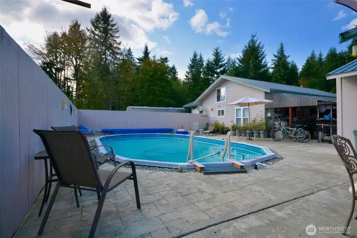 The concrete patio surrounding the pool is an immense 1,332 sq ft! The pool house contains a heating unit, filter and pump. The entire area is fenced for safety and security. The concrete patio surrounding the pool is an immense 1,332 sq ft! The pool house contains a heating unit, filter and pump. The entire area is fenced for safety and security.