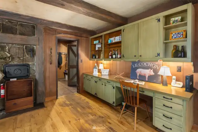 Off of the kitchen, check out this fabulous built-in with undercabinet lighting. Lots of great storage and desk space.
