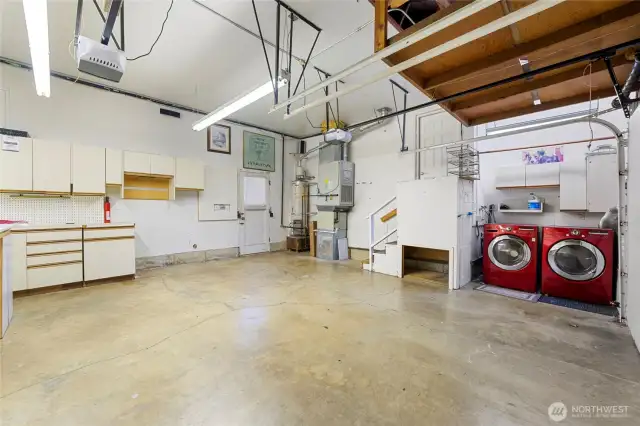 Generous 2-Car Garage has built in workspace and Laundry area