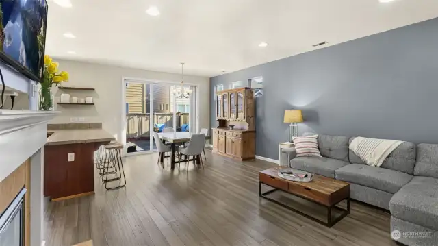 Living room flows seamlessly into the dining and kitchen area.