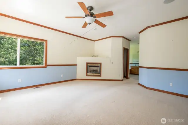 Primary bedroom includes gas fireplace  and his-hers walk in closets with organizer
