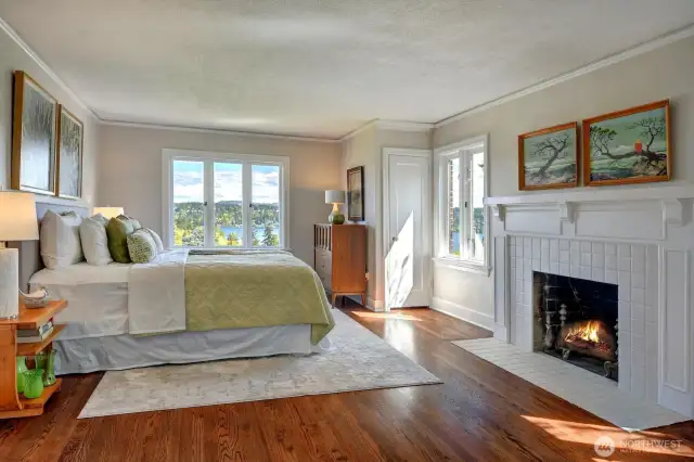 Watch the sun come up over Mt Rainier from bed in this huge primary bedroom with cozy gas fireplace.