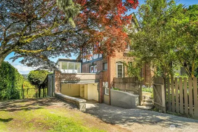 An oversized 1 car garage, space for 2 additional cars in the driveway, then overflow parking at left. Parking for all the parties you'll throw: Check!