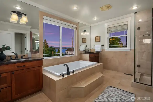 Large primary suite bathroom with soaking tub and double vanities
