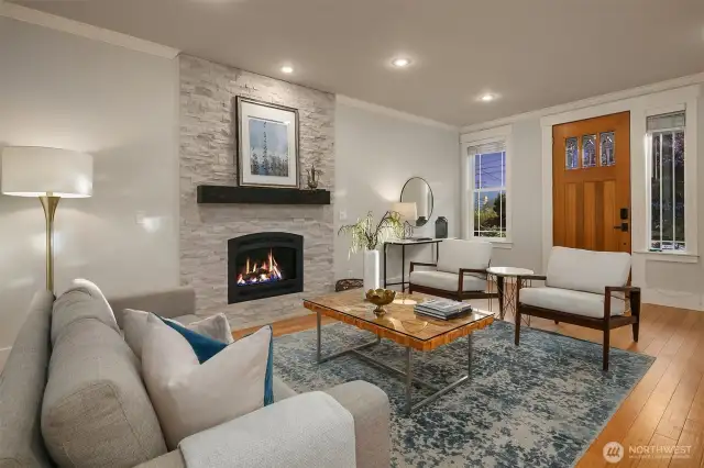 Welcoming living room with cozy gas fireplace greets you as you come through the front door