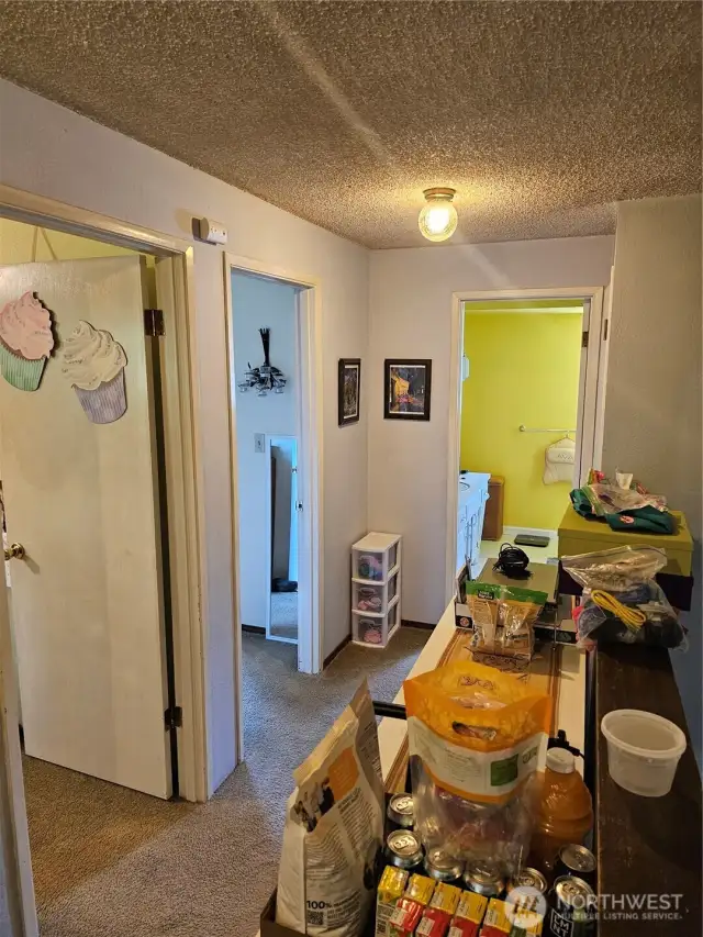 Units three and four are both 2 levels with the same floorplan. Upstairs Hallway.