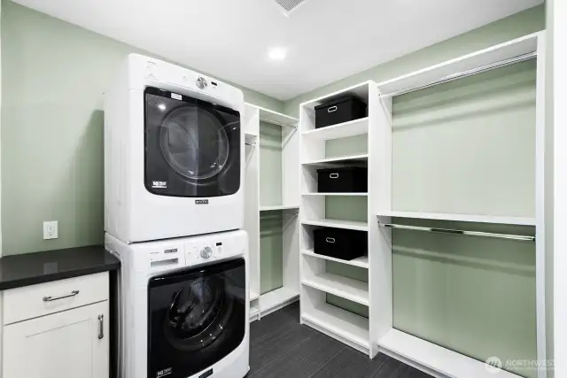 Laundry in primary suite walk-in closet